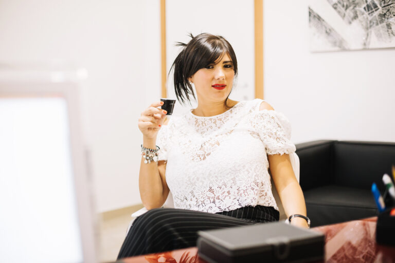 stylish-businesswoman-posing-with-cup-coffee
